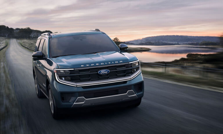 2025 Ford Expedition driving by a lake