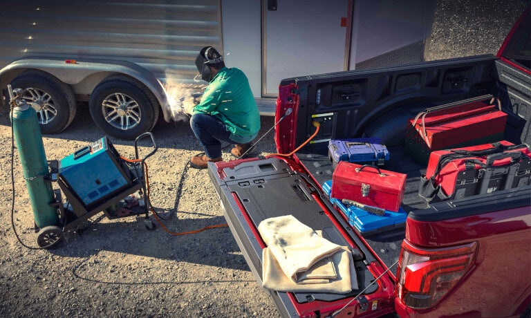 2025 Ford F-150 with bed open powering welding equipment